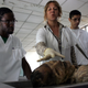 Dr. Nancy Magarita Gonzalez Rodriguez talks about anatomy with her students, including Jamar Williams (left) from Brooklyn, N.Y., at the Latin American School of Medical Sciences on Dec. 4, 2006, in Havana. The Cuban medical training model combines theory and practice and is oriented toward primary care, community medicine and hands-on internships.
Joe Raedle/Getty Images